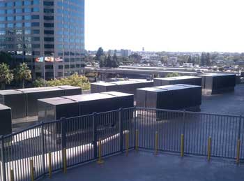 A total of 12 Bloom Energy Servers — also known as Bloom boxes — have been installed on the 5th floor of Adobe’s West Tower at its headquarters in San Jose, Calif. Each server is the size of an average parking space and contains thousands of Bloom fuel cells — flat, solid ceramic squares made from a sand-like powder — which will convert air and biogas (in this case, methane) into electricity via a clean electrochemical process, producing zero net carbon emissions.