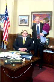 Gov. Jim Geringer (standing) and Rulon Gardner